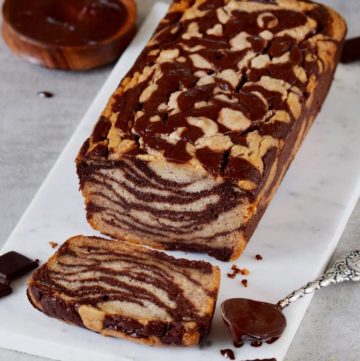 marbled banana bread with a piece of chocolate and a spoon