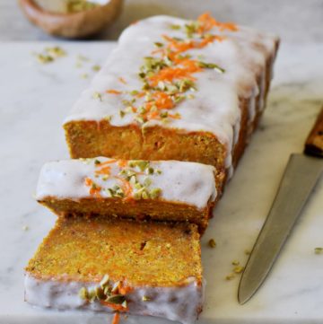 vegan carrot cake loaf with chopped nuts