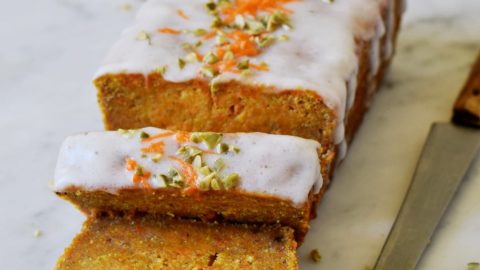 vegan carrot cake loaf with chopped nuts