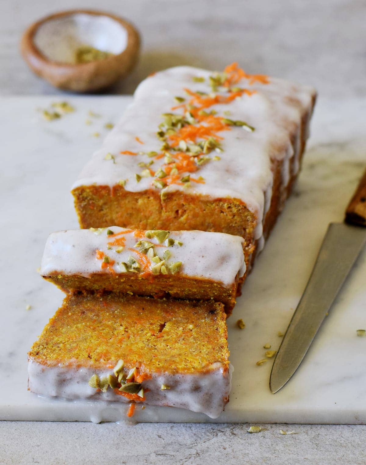 vegan carrot cake loaf with chopped nuts