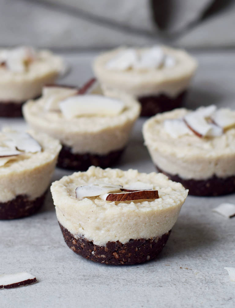 6 coconut cups with coconut flakes on top
