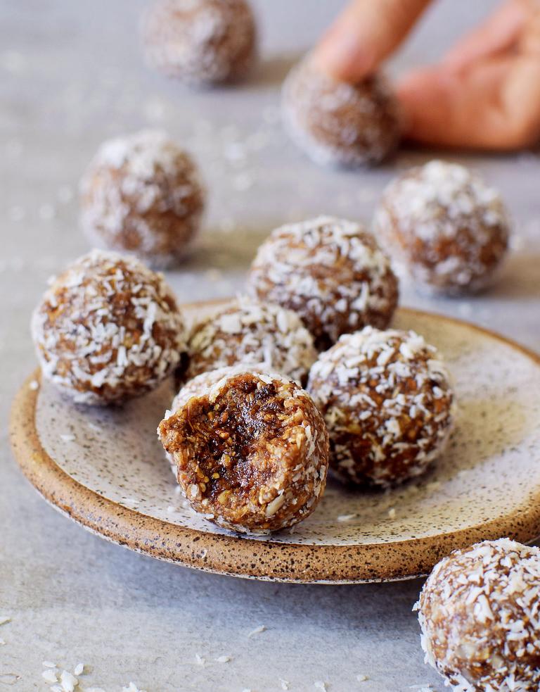healthy coconut coated truffles with dates sunflower seeds and mulberries