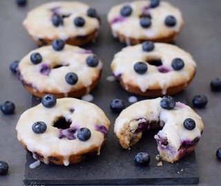 Baked blueberry donuts with a sugar free lemon glaze. These blueberry donuts are vegan, gluten free, refined sugar free, low in fat, healthy and delicious. Easy to make recipe!