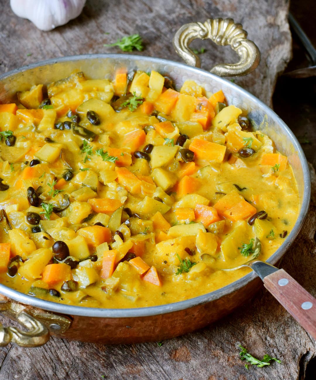 creamy coconut veggie stew with pineapple in a pot