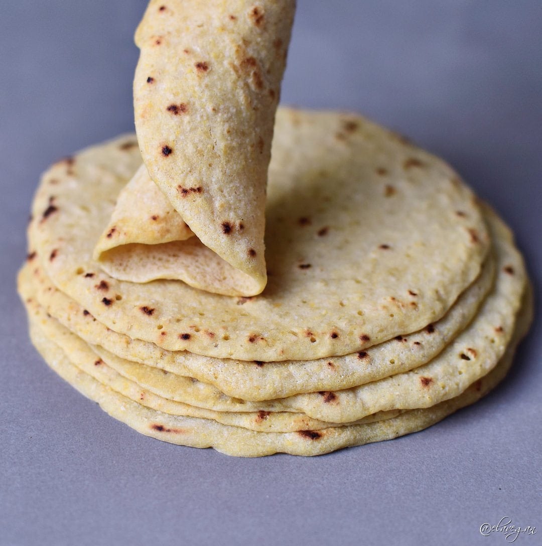 A tortilla stack with the top one rolled up