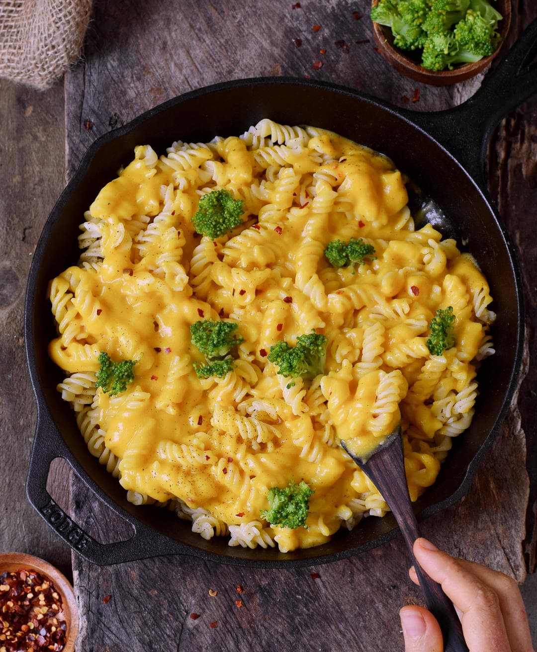 The best cheesy pasta with broccoli florets in black skillet