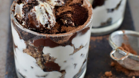 Gluten free tiramisu with gingerbread in a glass jar with spoon