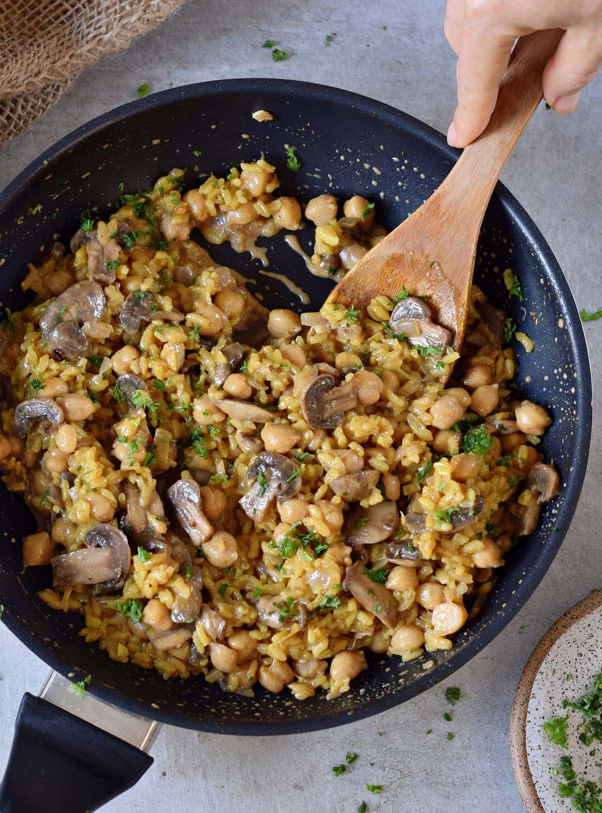 vegan mushroom risotto in a black pan