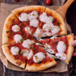 Best gluten-free pizza crust which is crispy, fluffy and not only great for all kind of pizzas (e.g. Pizza Margherita) but also for flat-bread and Calzone. The dough is crispy, vegan, egg-free, dairy-free, gum-free and easy to make.