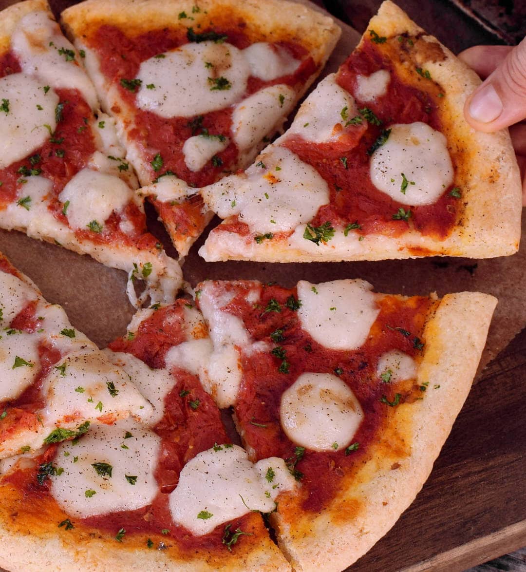 Close-up of vegan Pizza Margherita with the best gluten-free pizza crust