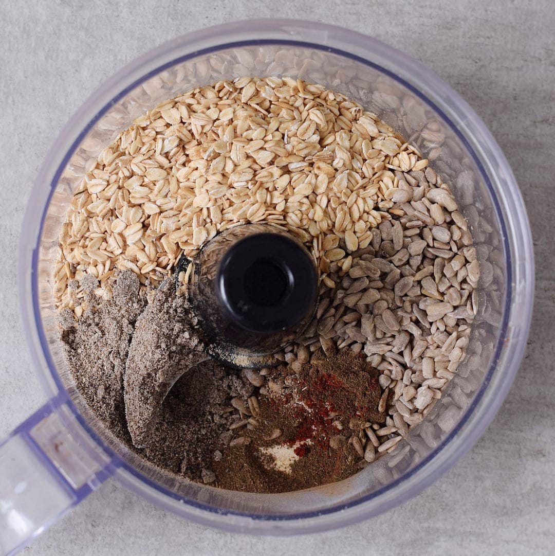 dry ingredients like oats and sunflower seeds in food processor