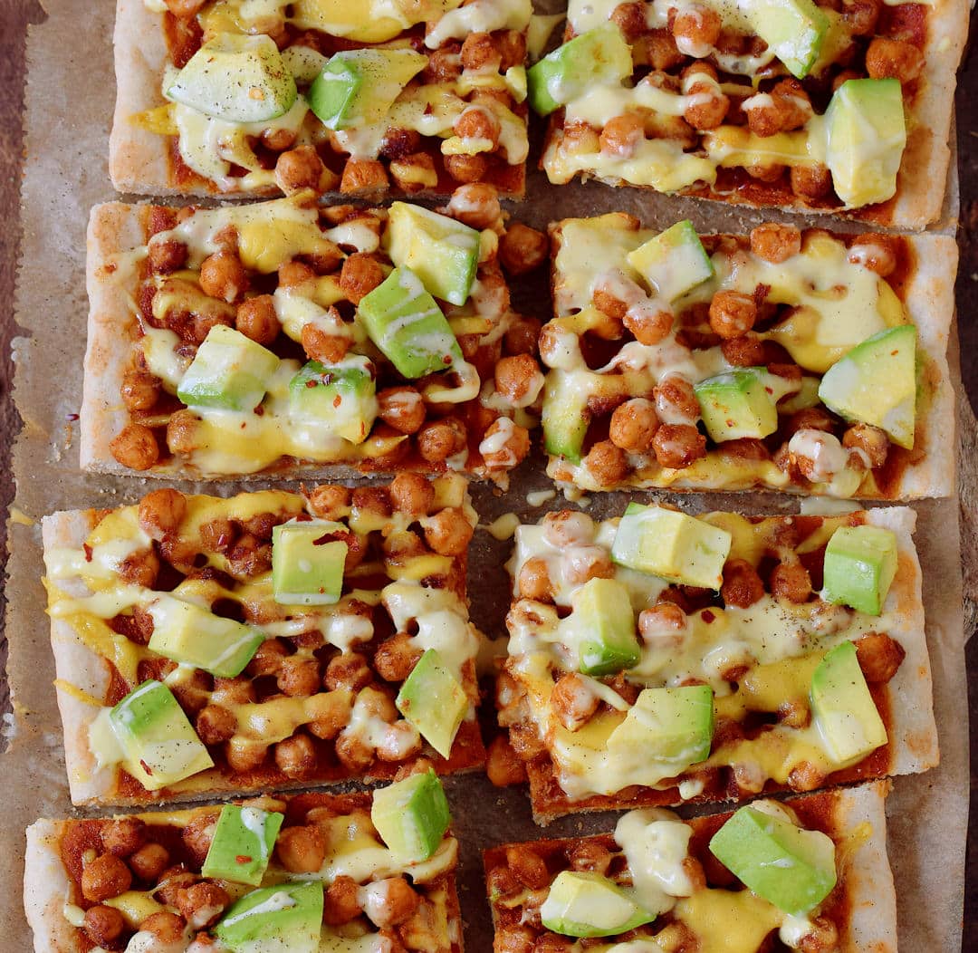 Avocado chickpea pizza with vegan cheese! This pizza is gluten-free, plant-based, contains healthy protein, fat, and carbs. Easy recipe which is perfect for lunch or dinner, especially on weekends.