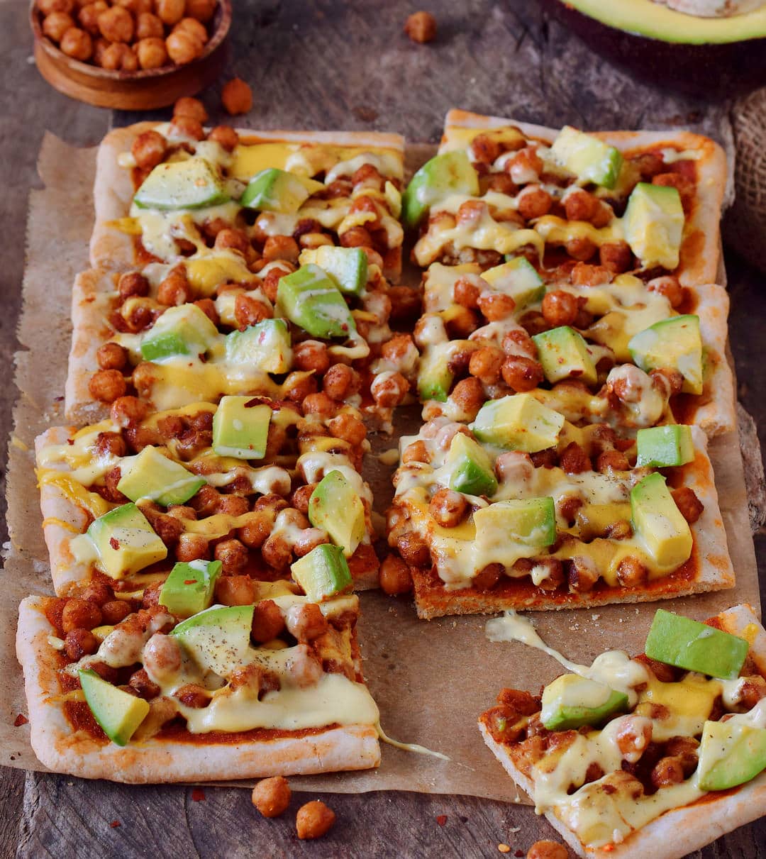 Avocado chickpea pizza with vegan cheese! This pizza is gluten-free, plant-based, contains healthy protein, fat, and carbs. Easy recipe which is perfect for lunch or dinner, especially on weekends.
