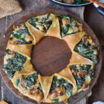 Gluten-free Pizza ring with spinach mushrooms and vegan cheese