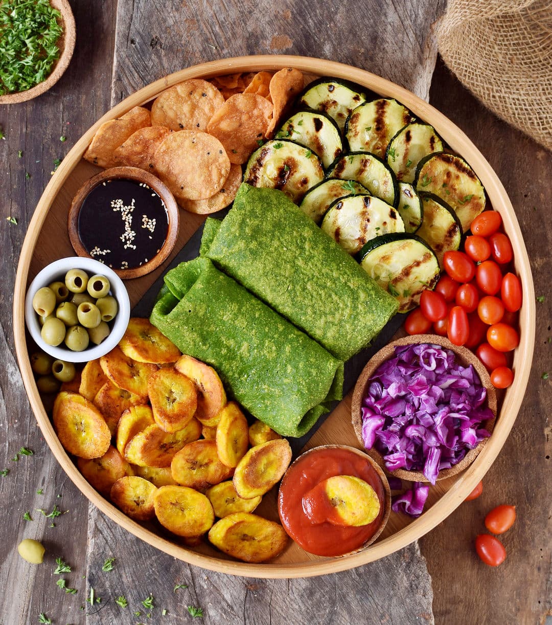 2 Spinach wrap on a snack platter with plantains and veggies