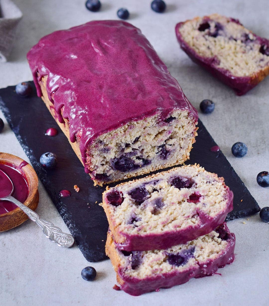 sliced blueberry bread with maqui berry frosting