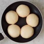 vegan gluten-free steamed yeast dumplings in pan after cooking