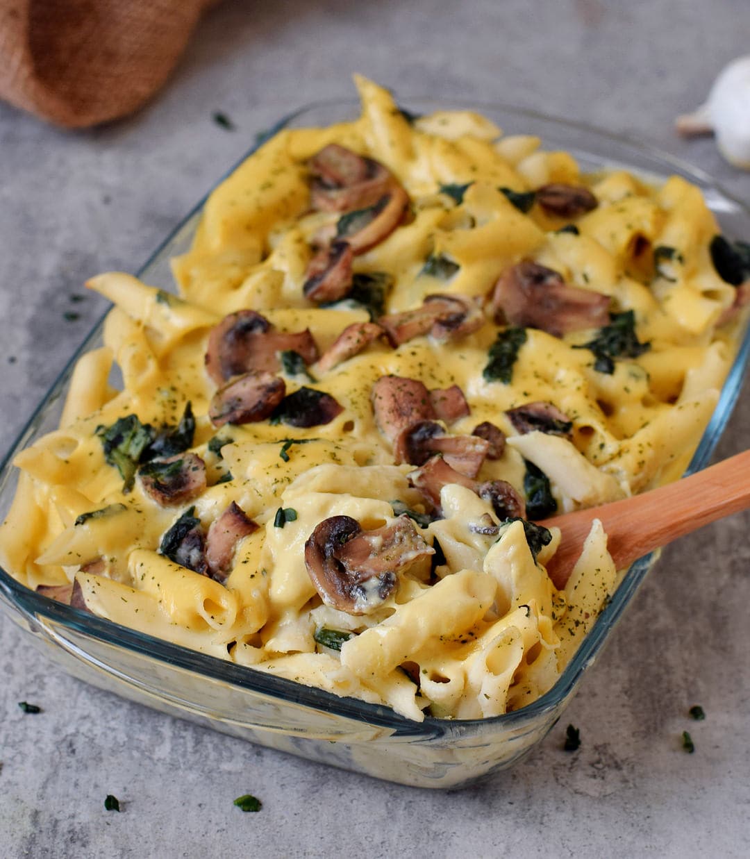 close-up of baked penne casserole with mushrooms and spinach