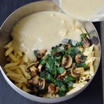 Vegan pasta bake recipe with cauliflower, mushrooms and spinach. This plant-based dinner or lunch is gluten-free, healthy and easy to make. Recipe for vegan cheese sauce included.