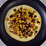 gluten-free tortilla with vegan cheese sauce and veggies to make vegan quesadillas