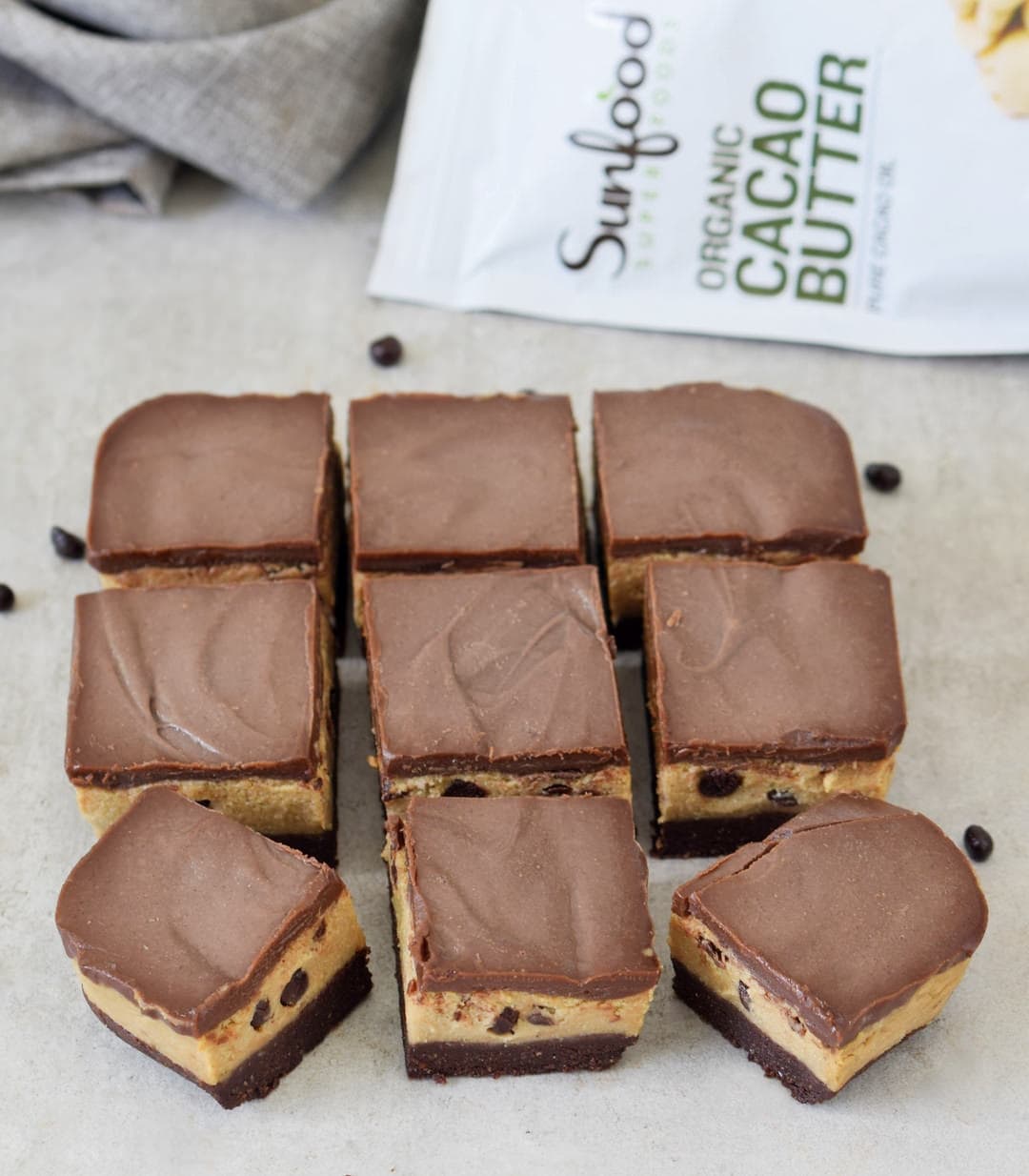 vegan chocolate bars from above with Sunfood cacao butter bag