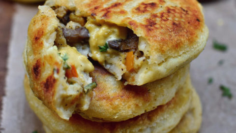 Gluten-free stuffed potato cakes with vegan cheese sauce
