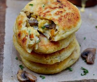 Vegan cheese stuffed potato cakes with mushrooms