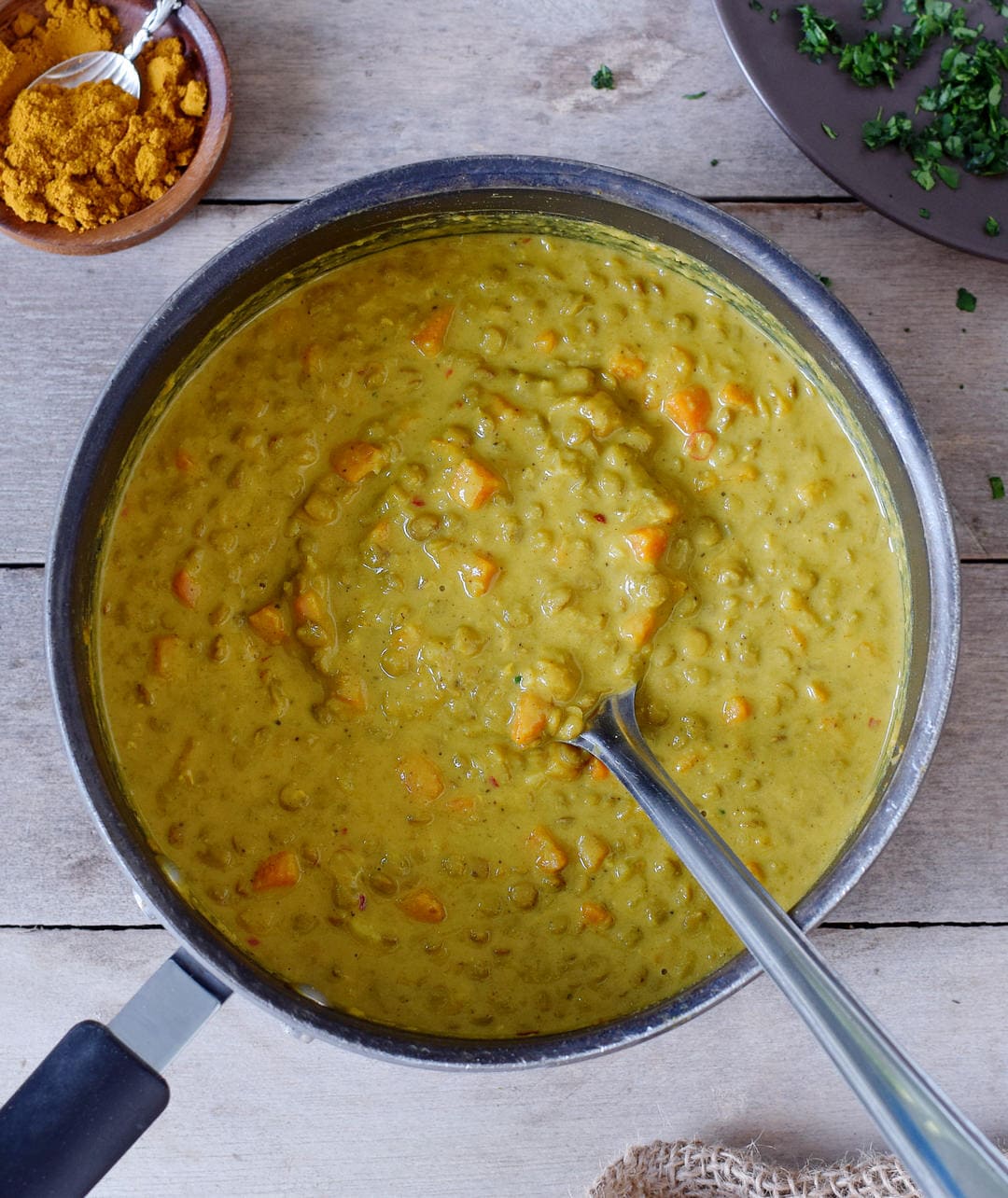 healthy lentil dal with carrots in a pot