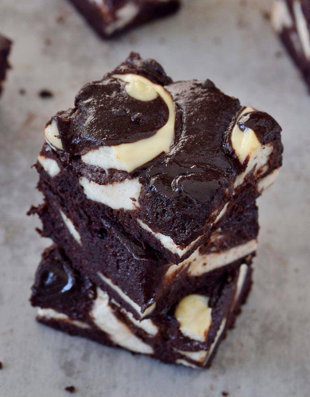 A stack of 3 vegan cheesecake brownies from above