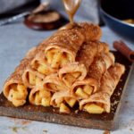 10 apple cinnamon crepes drizzled with homemade caramel sauce