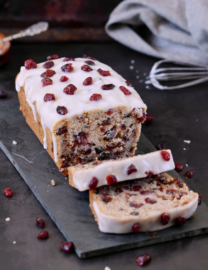 Healthy vegan Cranberry Loaf with a sugar-free frosting and dried cranberries