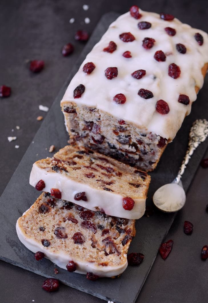 Healthy cranberry bread with a sugar-free frosting and dried cranberries