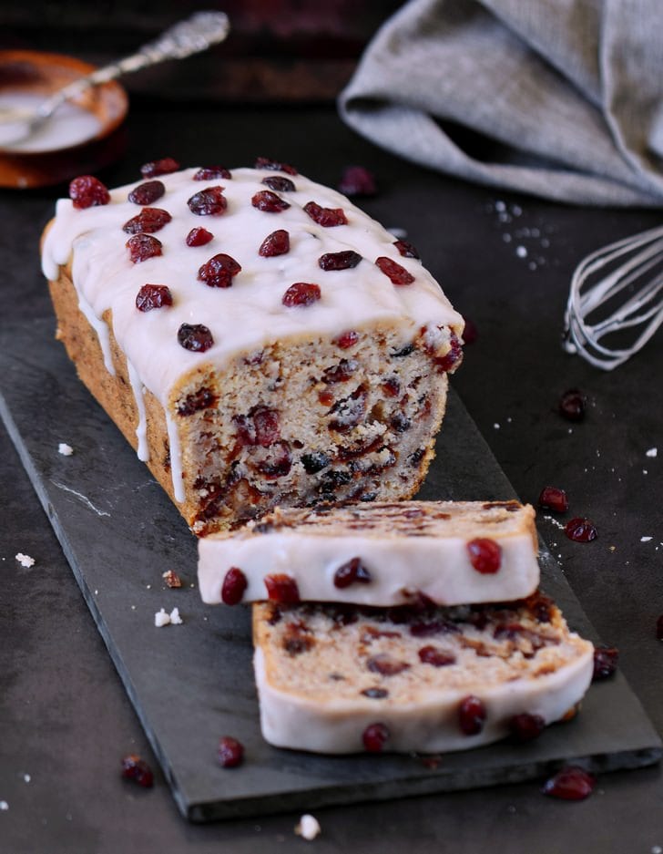 Vegan cranberry bread with sugar-free frosting and dried cranberries on top