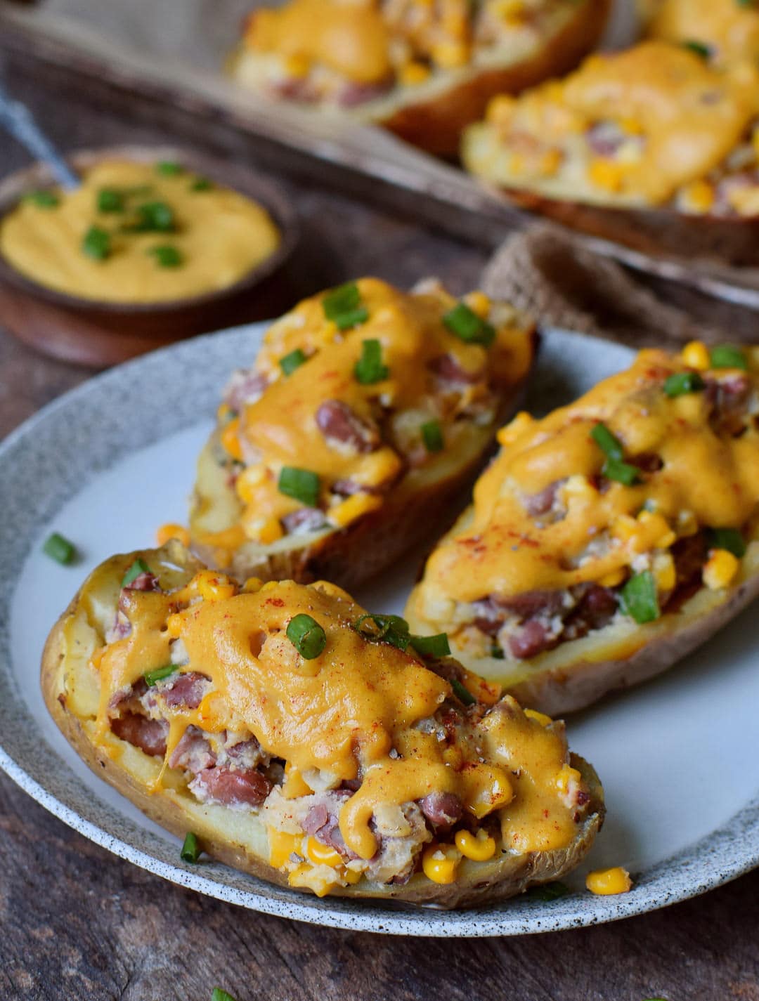 stuffed potato skins with vegan cheese on a plate