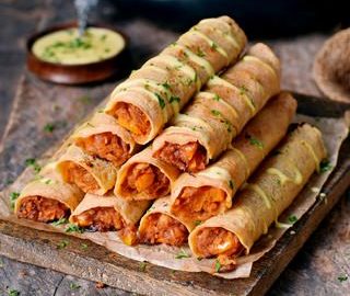 Gluten-free Buffalo chickpea taquitos with vegan cheese drizzle 320x320