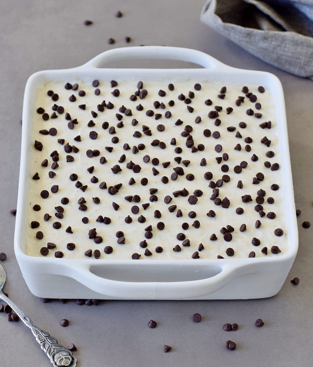 chocolate lasagna with vegan mini chocolate chips in a white baking dish