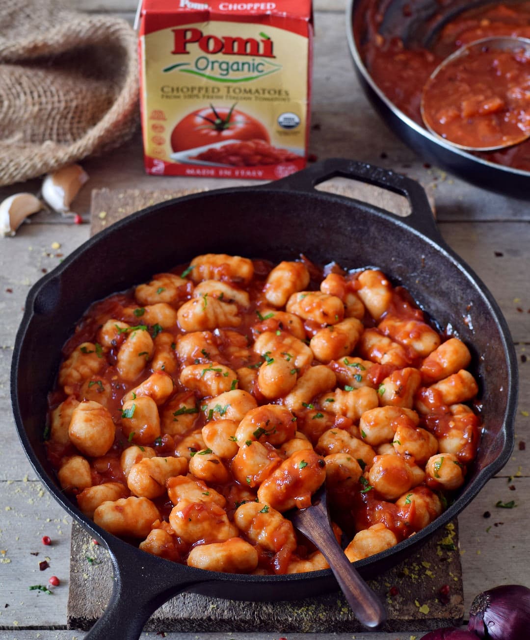 gnocchi all'arrabbiata in a skillet made with pomi tomatoes