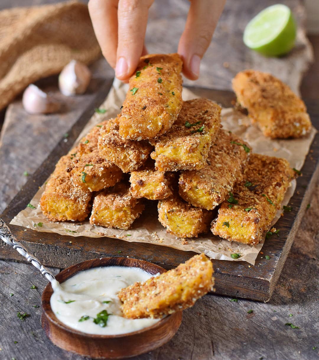 close-up polenta fries with gluten-free breading and plant-based cashew garlic dip