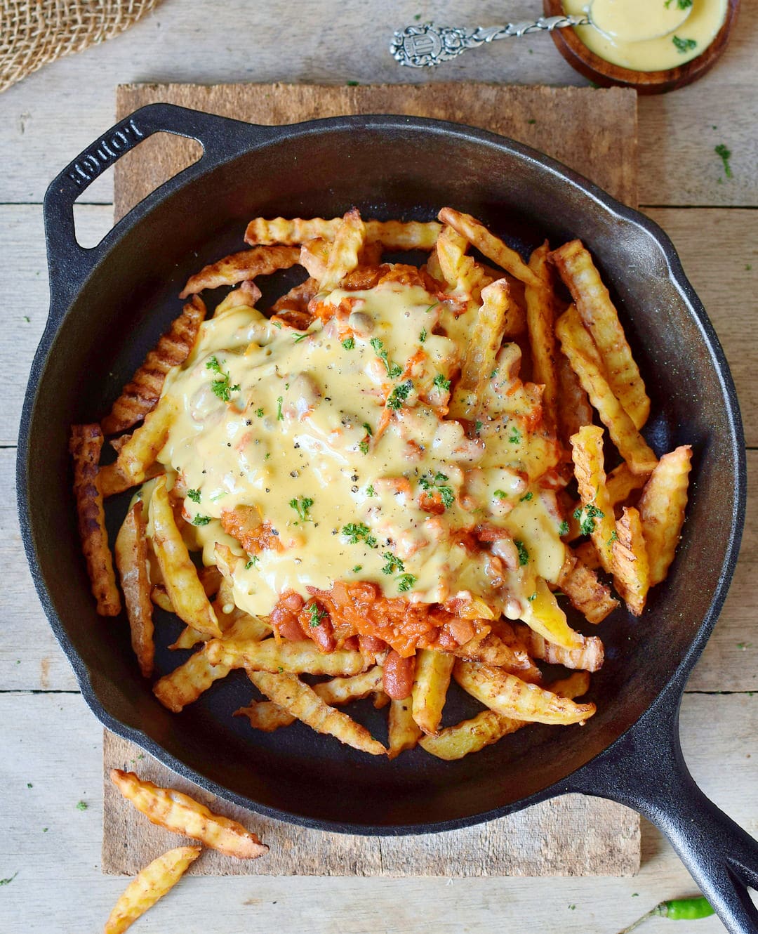 vegan chili cheese fries from above in a black skillet