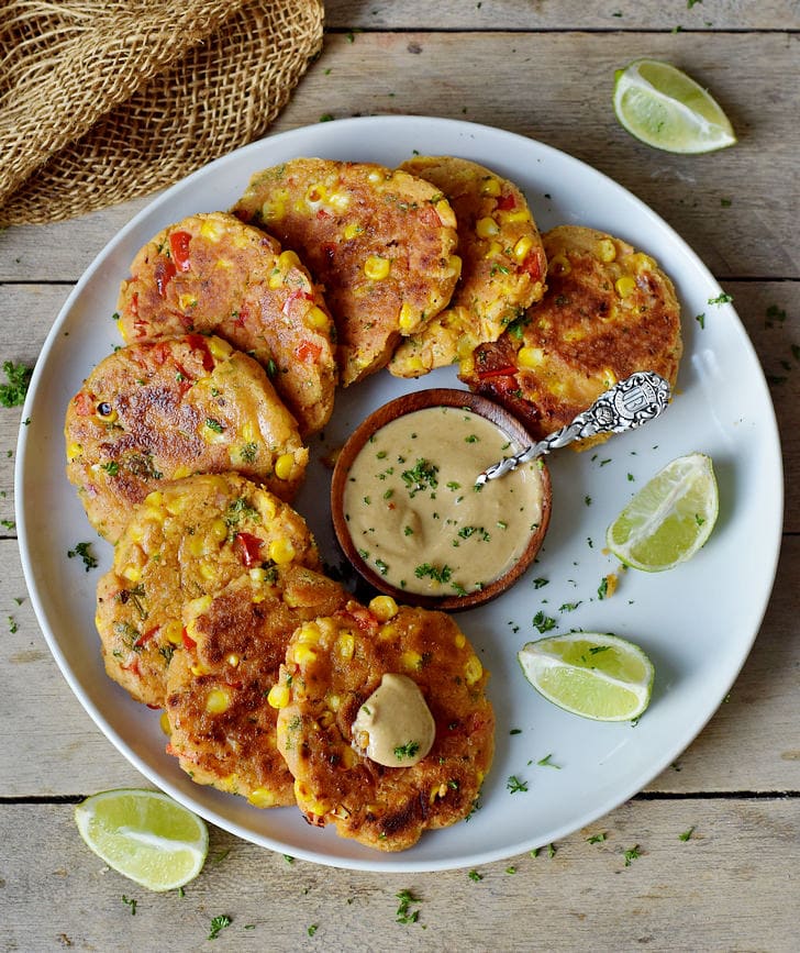veggie chickpea fritters with corn and pepper on a plate