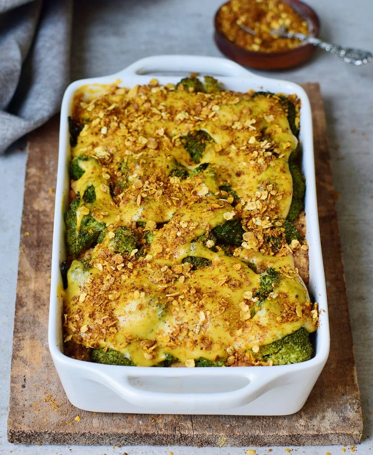 cheesy broccoli quinoa casserole (gratin) in a white pan