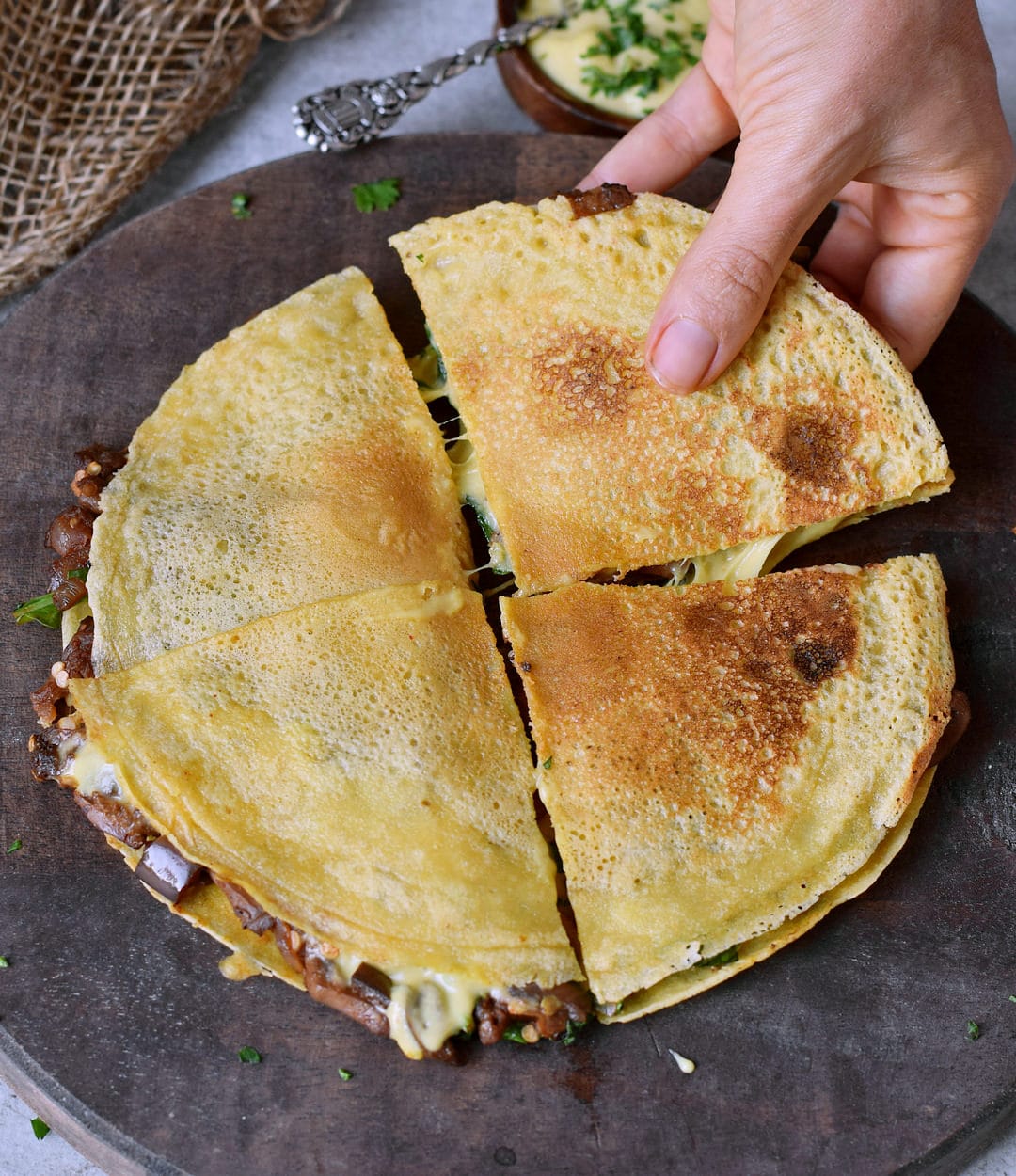 spinach quesadillas filled with eggplant and vegan cheese