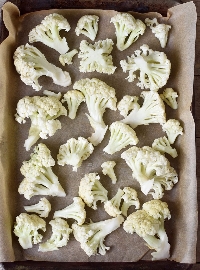 cauliflower florets on baking sheet before roasting