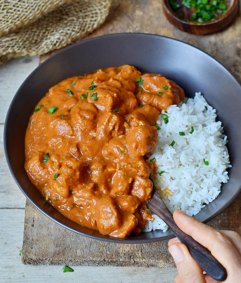 eating Vegan Butter Chicken with rice