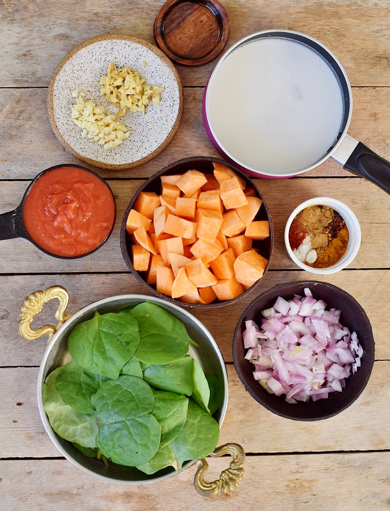 Ingredients to make vegan tikka masala with sweet potatoes and coconut