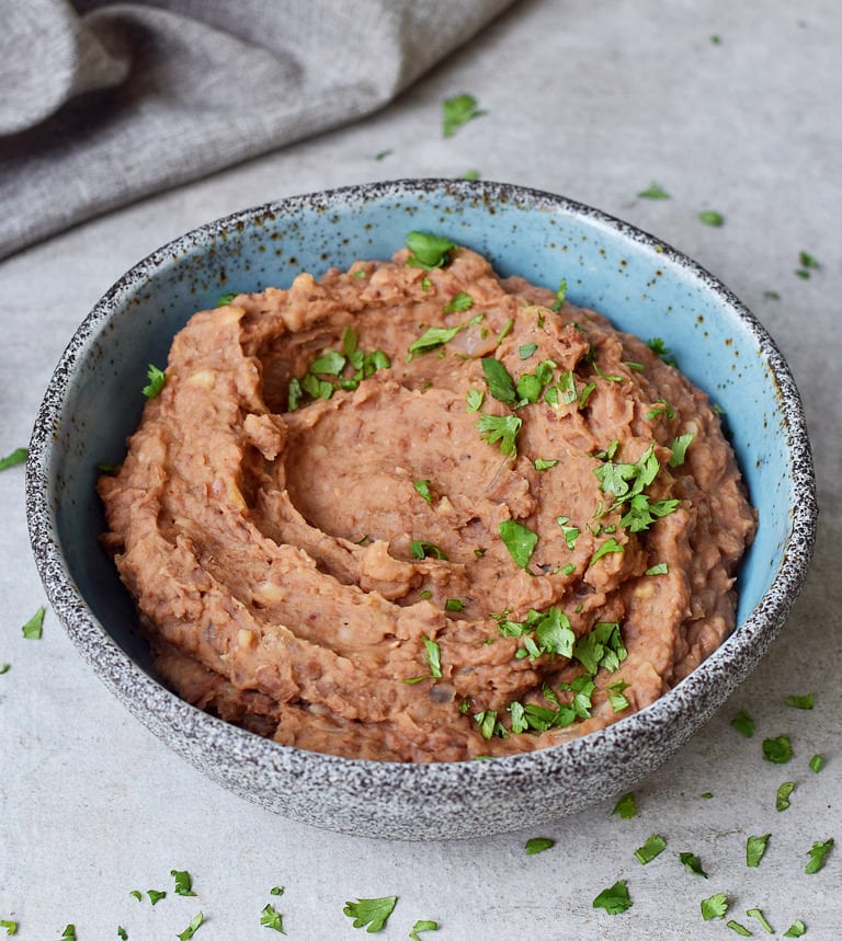 Instant Pot Refried Beans in a blue bowl