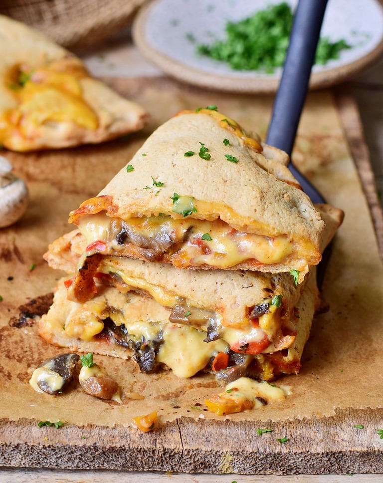easy pizza calzone pocket with mushrooms peppers and vegan cheese
