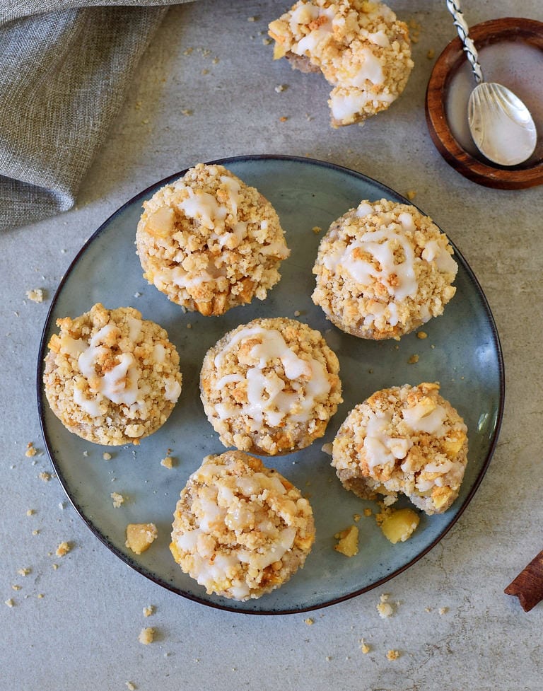 6 gluten-free apple muffins on a gray plate