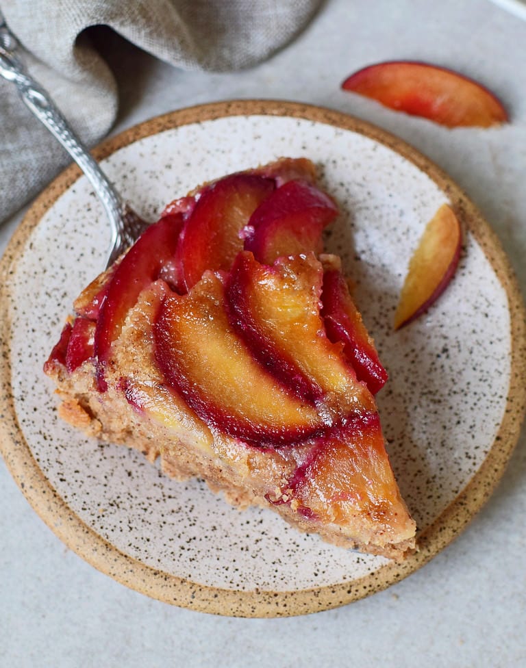 close-up of a piece of pie with plums