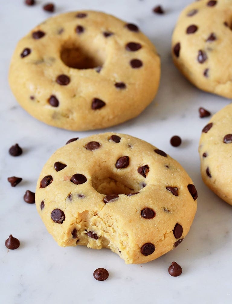Edible vegan chickpea cookie dough shaped into donuts
